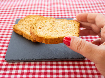 Close-up of hand holding bread