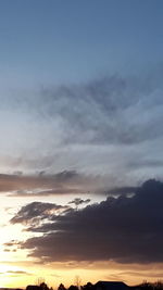 Low angle view of dramatic sky during sunset