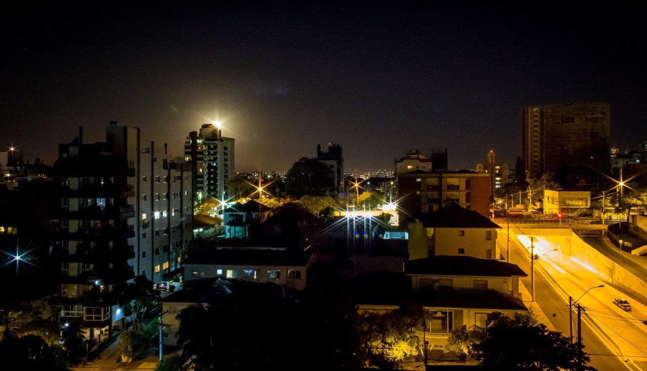 illuminated, night, city, building exterior, architecture, cityscape, built structure, urban skyline, skyscraper, no people, travel destinations, sky, modern, outdoors