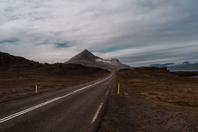 Empty road against sky