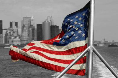 Low angle view of american flag against sky