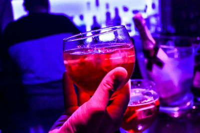 Close-up of hand holding wine glass