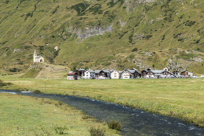 Scenic view of field against mountain