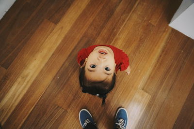 Woman walking on wooden floor