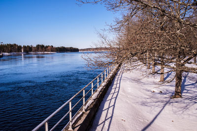 Scenic view of frozen lake against clear sky