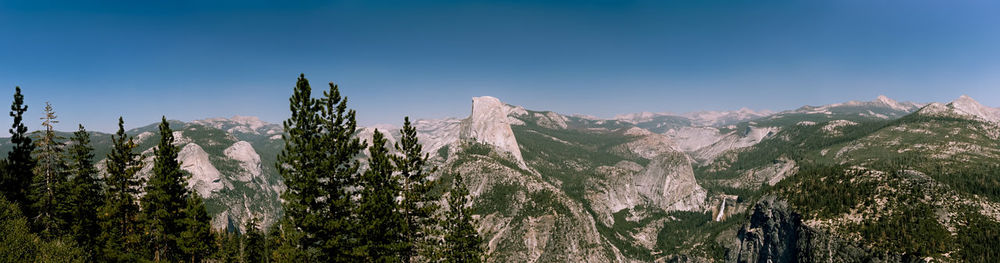 Panoramic view of mountain against blue sky