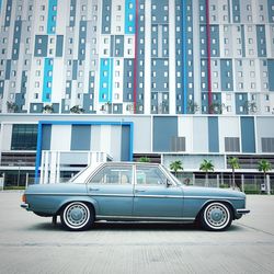 Car against building on street