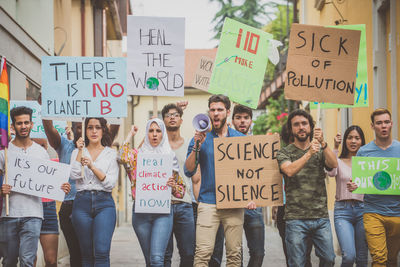 People protesting while standing on land