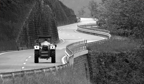 High angle view of man riding motorcycle on road