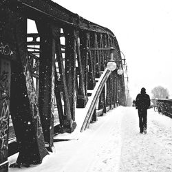 Full length of woman walking on bridge