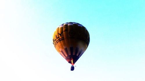 Low angle view of hot air balloon against clear sky