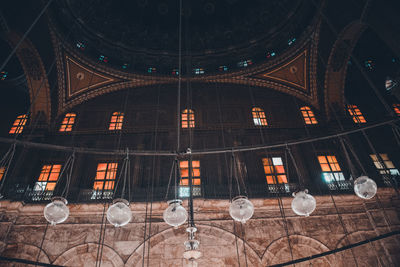 Low angle view of hanging lights at mosque