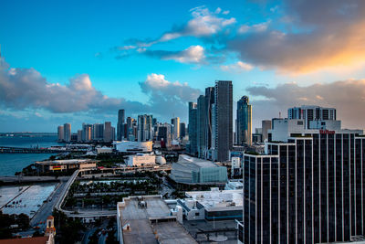 Modern buildings in city against sky