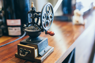 Close-up of machinery on table