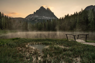 Scenic view of field against sky during sunset