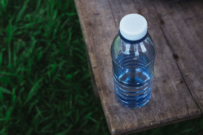 High angle view of glass bottle on table