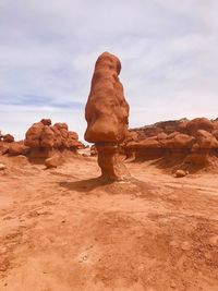 Rock formations in desert against sky