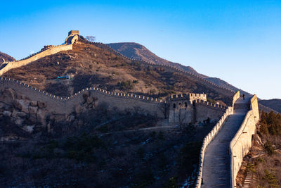 View of fort against mountain range. great wall of china.