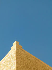 Low angle view of building against blue sky