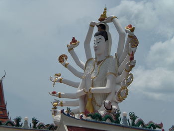 Low angle view of statue against sky