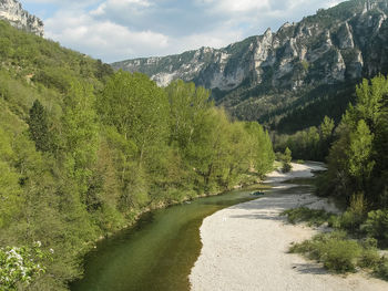 Scenic view of green mountains against sky