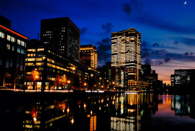 Illuminated buildings in city at night