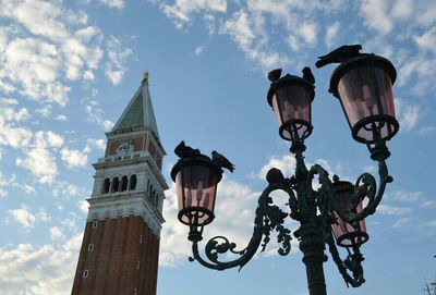 Low angle view of street light against sky