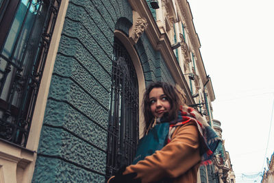 Portrait of young woman standing in winter