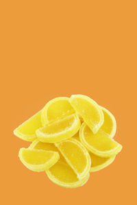 Close-up of fruit against orange background