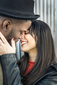 Portrait of smiling young woman wearing hat