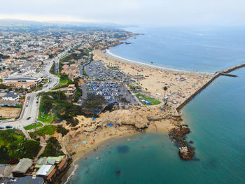 High angle view of sea and buildings against sky