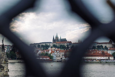 Cityscape against cloudy sky