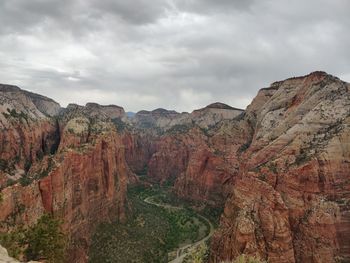 Scenic view of mountain against cloudy sky