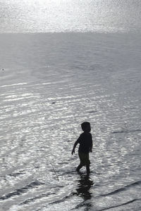 Full length of man standing on beach