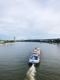 Boat sailing in sea against sky