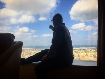 Man sitting on rock