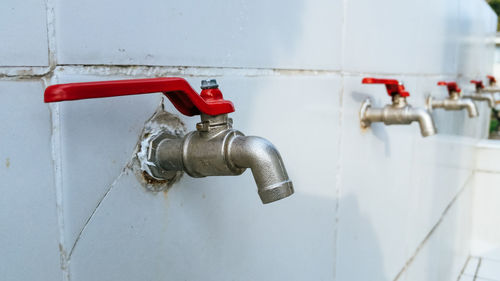 Close-up of pipes against wall