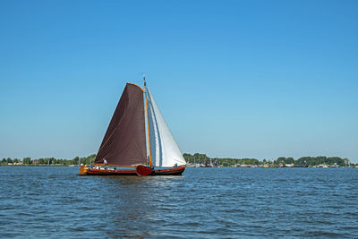 Traditional frisian wooden sailing ship in a yearly competition in the netherlands