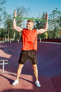 Full length of a young man standing outdoors