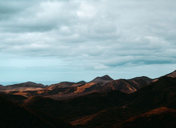 Aerial brown mountains landscape with a cloudy sky from puerto rico south side