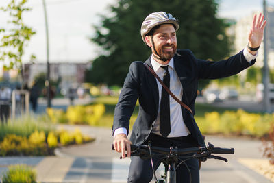 Portrait of young man riding bicycle