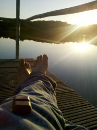 Low section of man relaxing on hammock