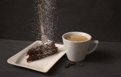 Close-up of chocolate cake and coffee on table