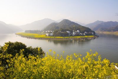 Scenic view of lake and mountains against sky