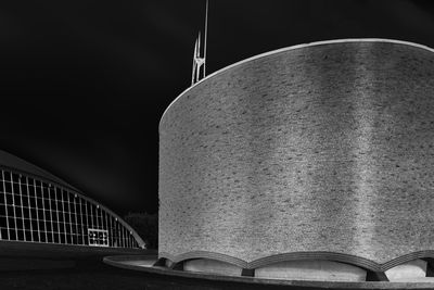 Low angle view of bridge against sky at night