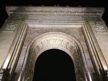 Low angle view of historic building against sky at night