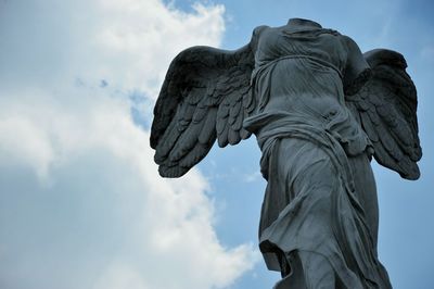 Low angle view of statue against sky