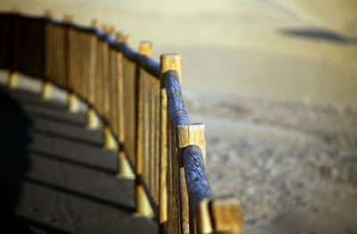 High angle view of metal fence against blurred background