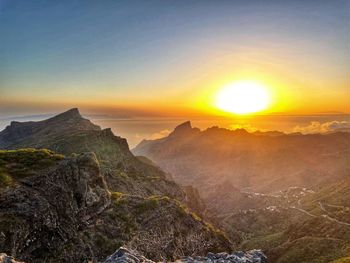 Scenic view of mountains against sky during sunset