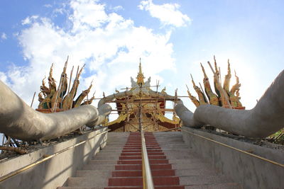 Low angle view of sculpture of building against sky